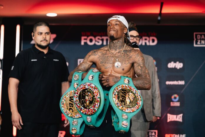 O'Shaquie Foster holds belt at weigh-in ahead of his boxing bout against Raymond Ford