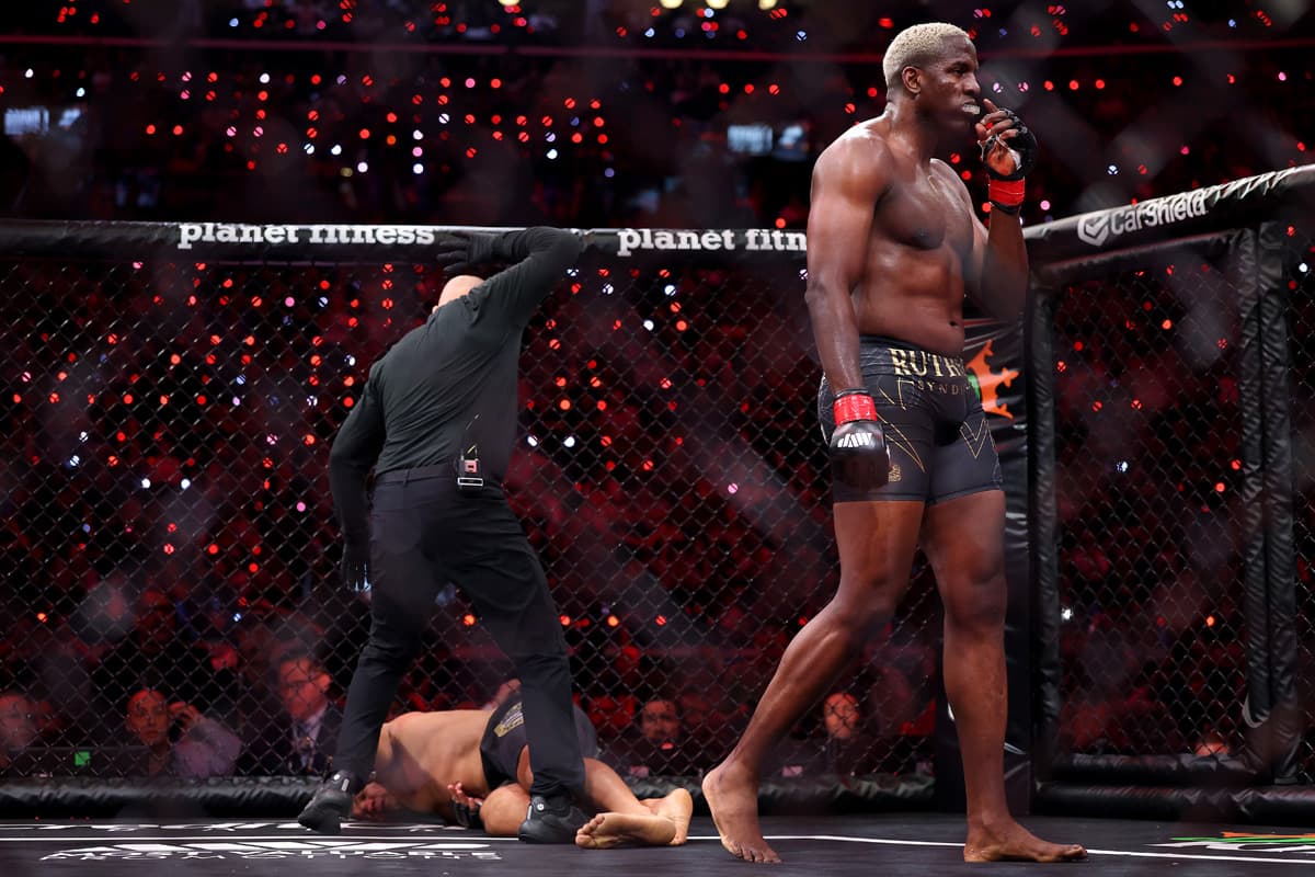 Robelis Despaigne walking off as Junior dos Santos is on the ground