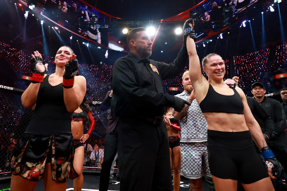 Ronda Rousey having her hand raised in victory