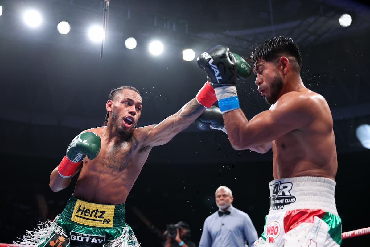 Yan Santana throws a jab during his bout against Cristian Cruz