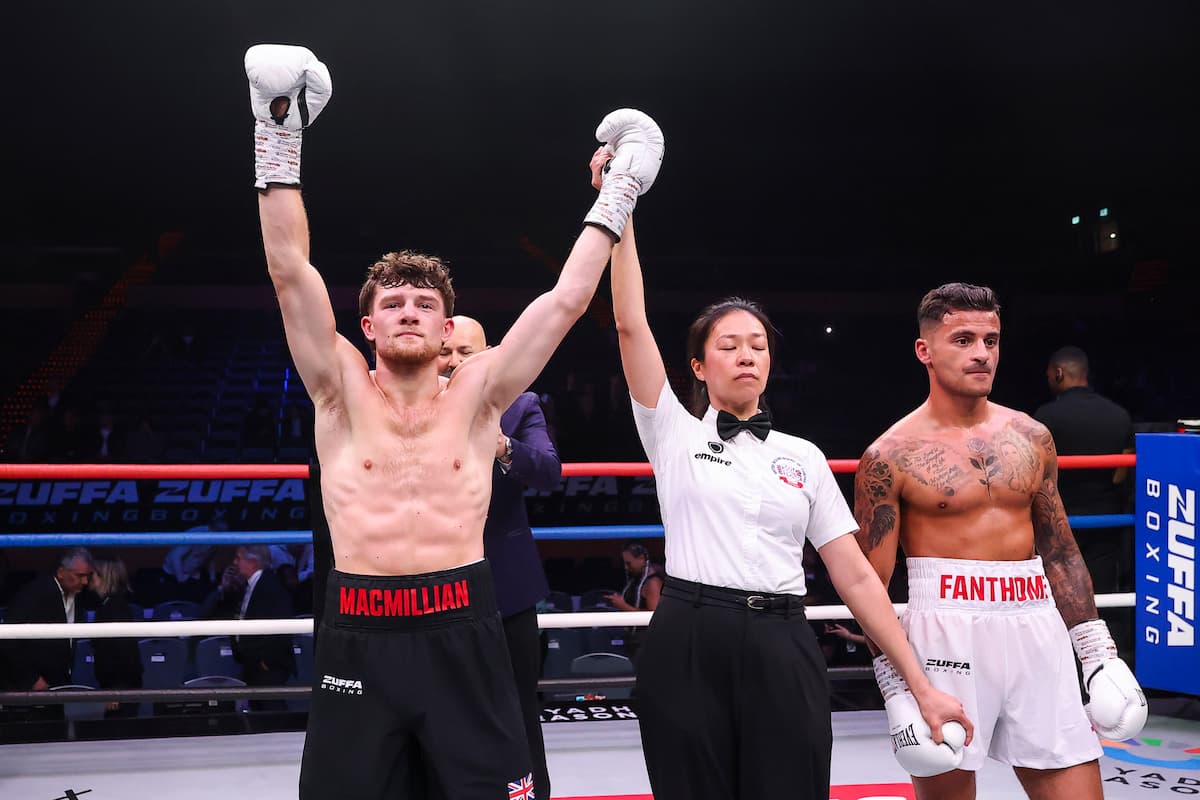 The referee raises Alex MacMillan’s hand in victory over Leo Fanthome