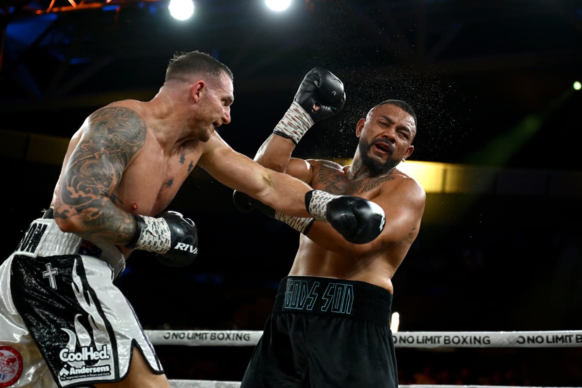 Demsey McKean throws a punch during his bout against Liam Talivaa