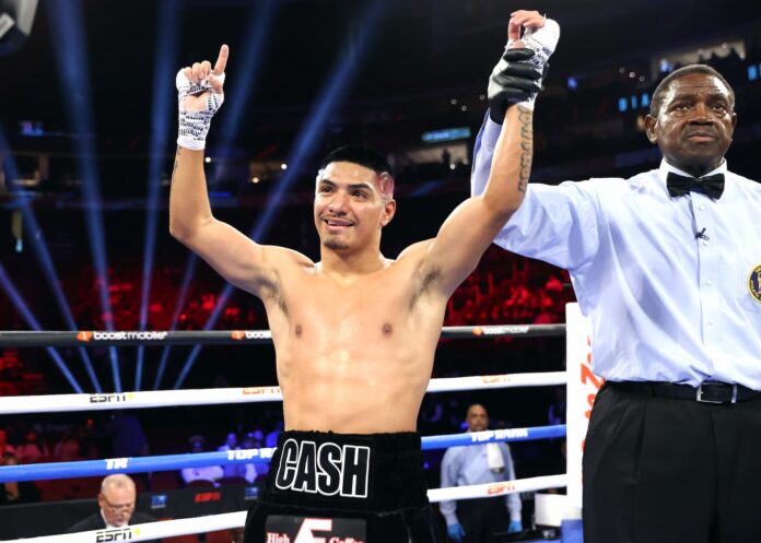 Floyd Diaz has his hand raised after victory over Juan Hernandez