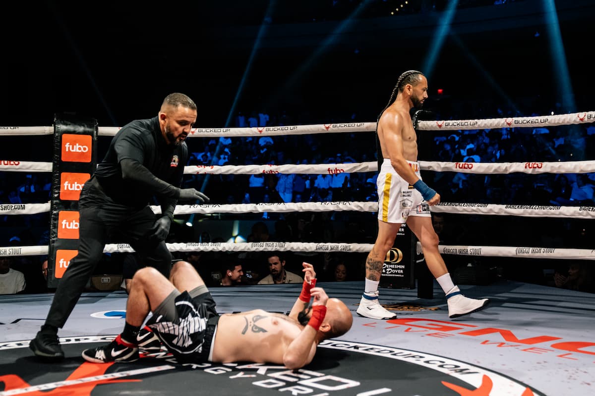 Gee Perez knocks down Mike Hansen during their bout
