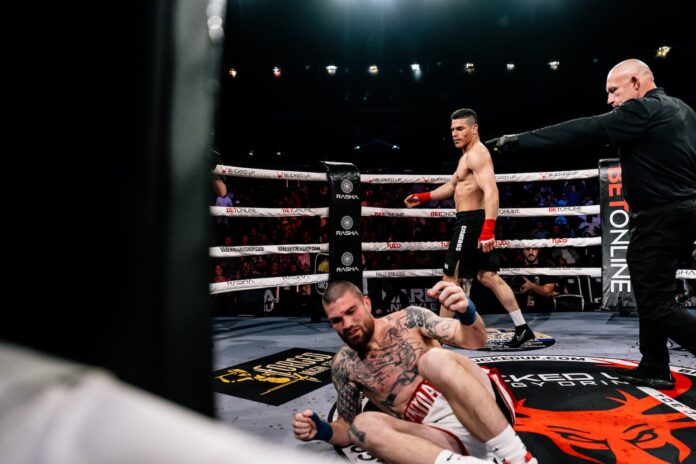 Gregoris Cisneros knocks down Cameron Vancamp during their bout at BKFC Hammond