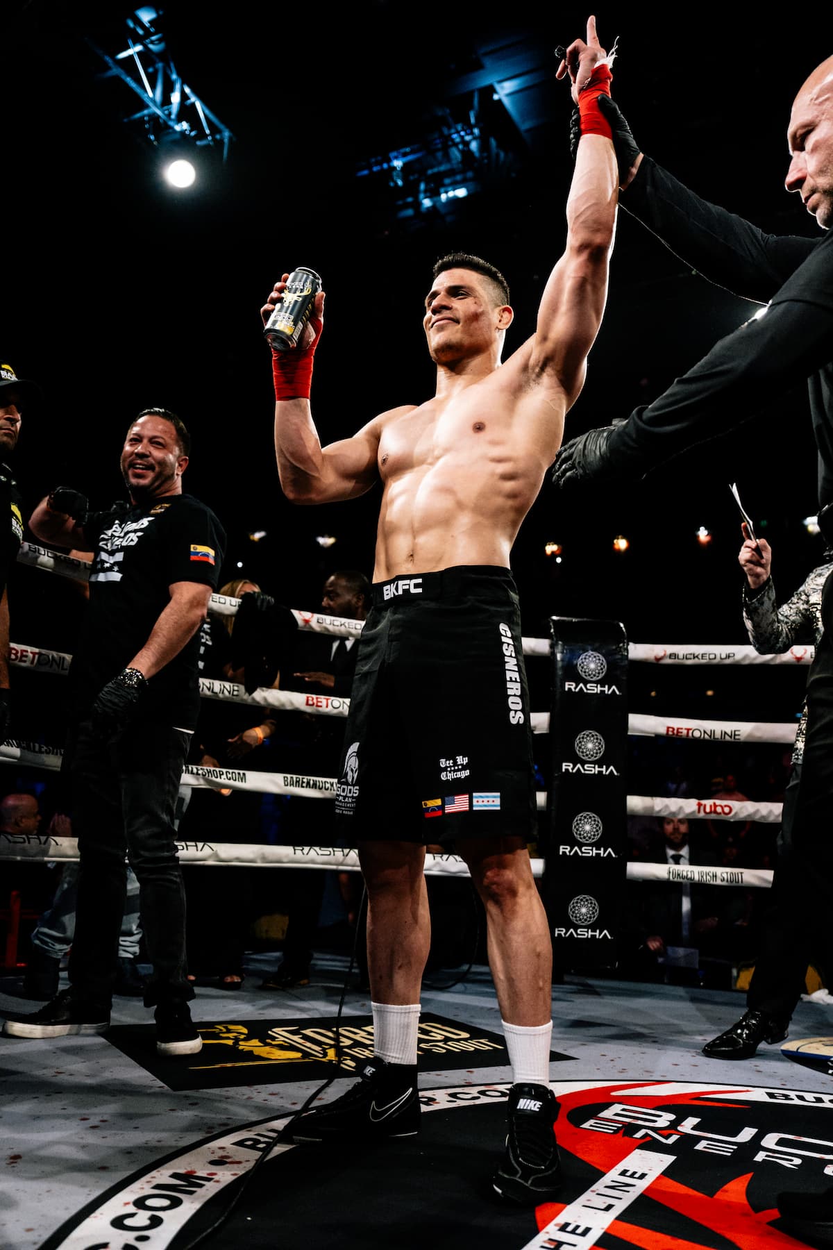 Gregoris Cisneros has his hand raised by the referee in victory over Cameron Vancamp