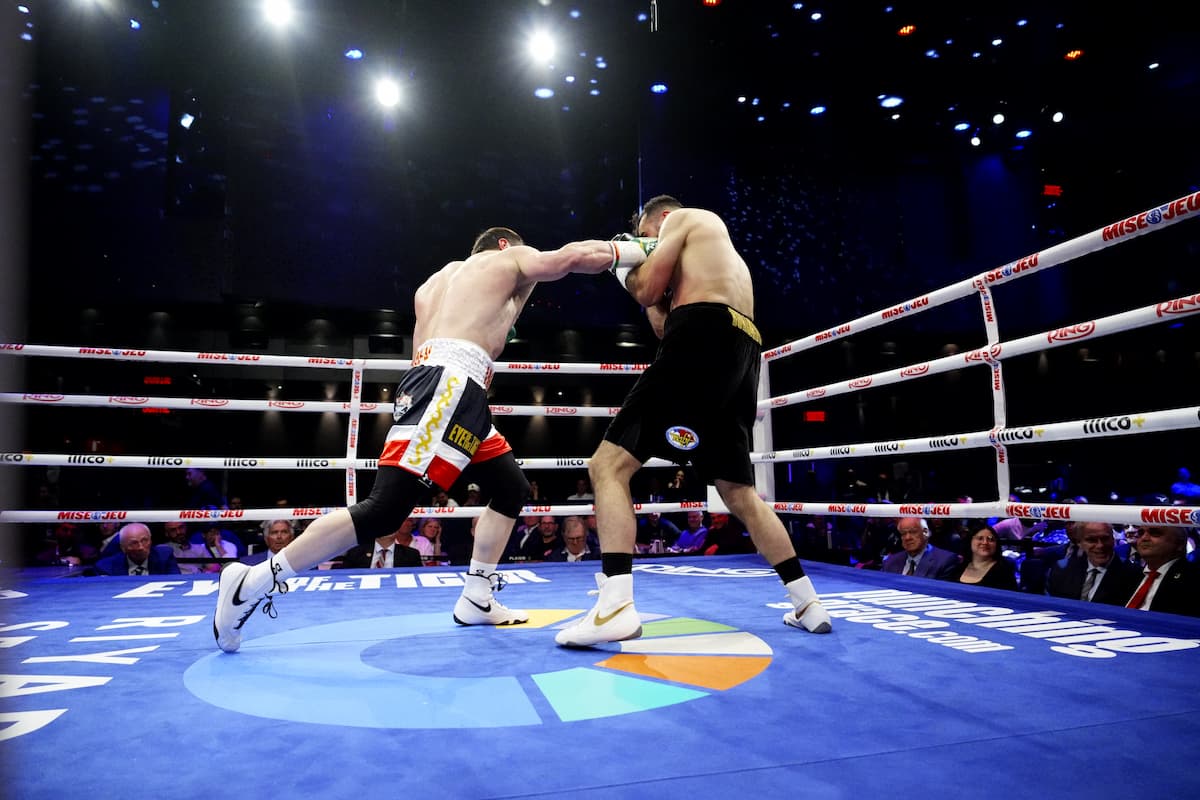 Imam Khataev lands a punch during his bout against Mickael Diallo