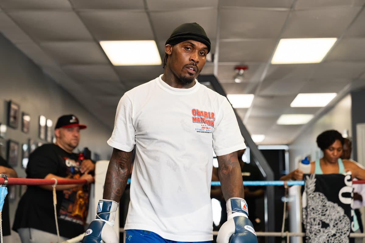 Jermall Charlo wearing boxing gloves inside the ring during a media workout