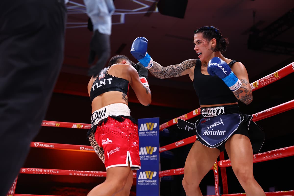 Jully Poca throws a hook during her bout against Monica Medina