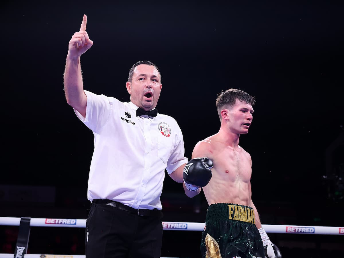 Referee Kieran McCann deducts a point from Edward Hardy during his bout against Jesus Carrasco
