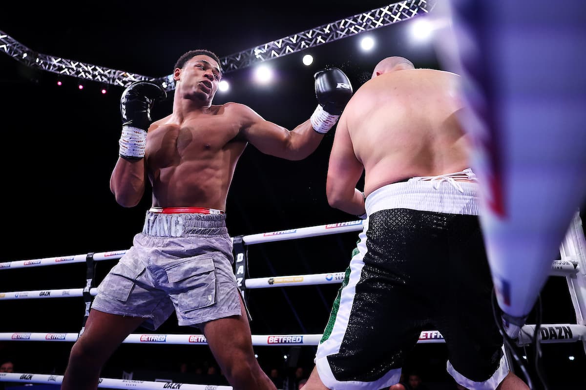 Leo Atang throws a hook during his bout against Fouad Shaili