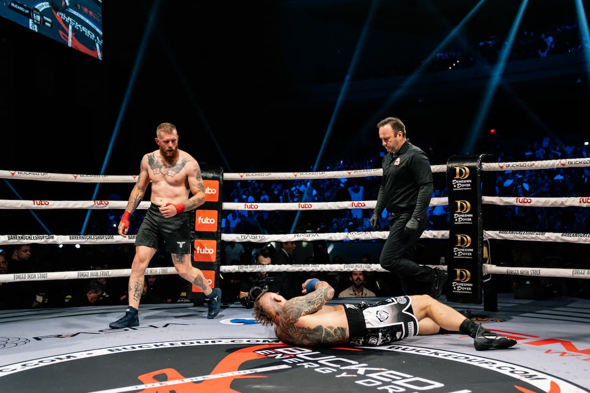 Mike Jones knocks down Stephen Townsel during their bout