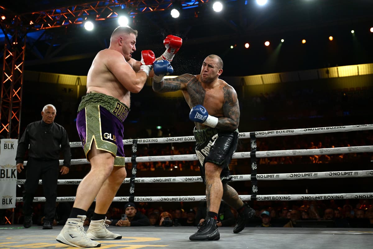 Nelson Asofa-Solomona throws a punch during his bout against George Burgess