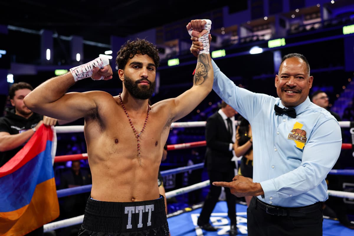 Nikolai Terteryan has his hand raised by the referee after victory over DePriest Johnson