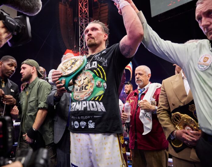 Oleksandr Usyk having his hand raised by the referee after victory over Rico Verhoeven