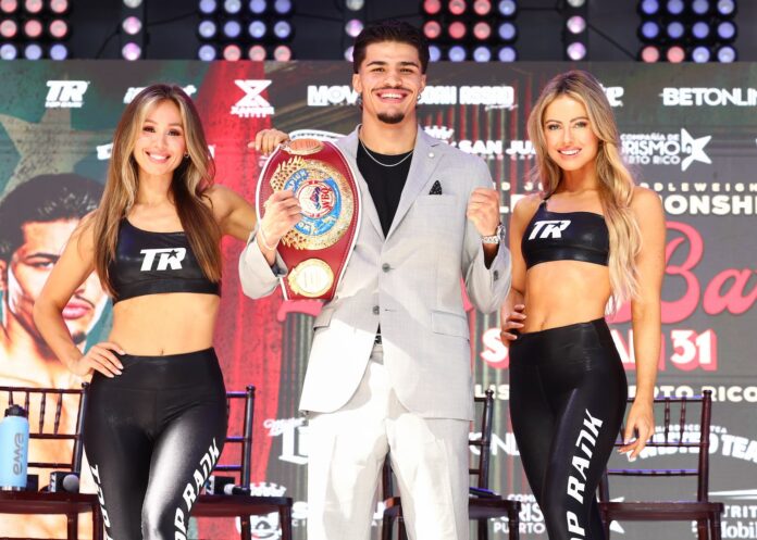 Xander Zayas with Top Rank Knockouts ring girls at press conference