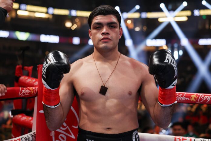 Yair Gallardo poses in the ring after his victory over Carlos Miranda
