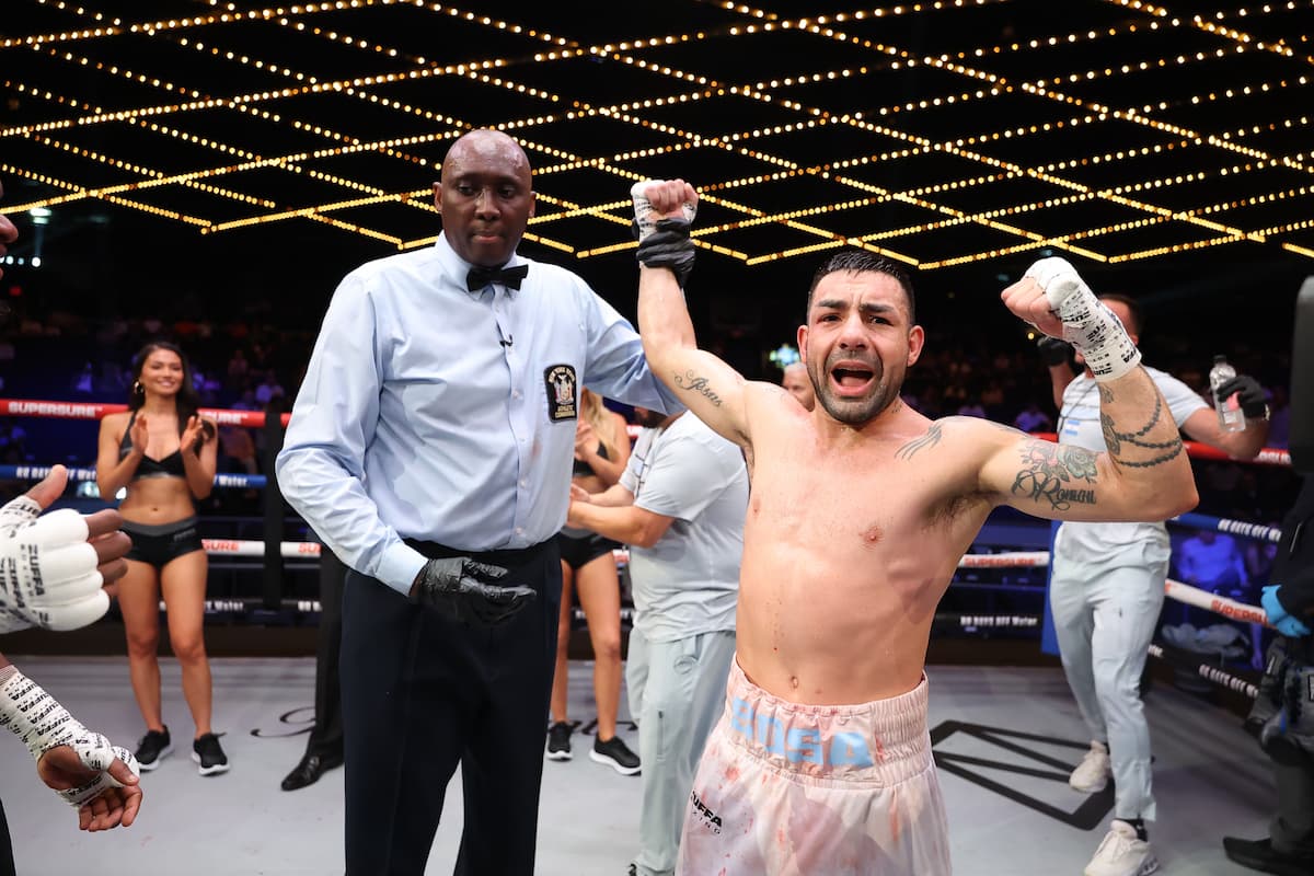 Andres Sosa has his hand raised by the referee after his victory over Dominique Francis