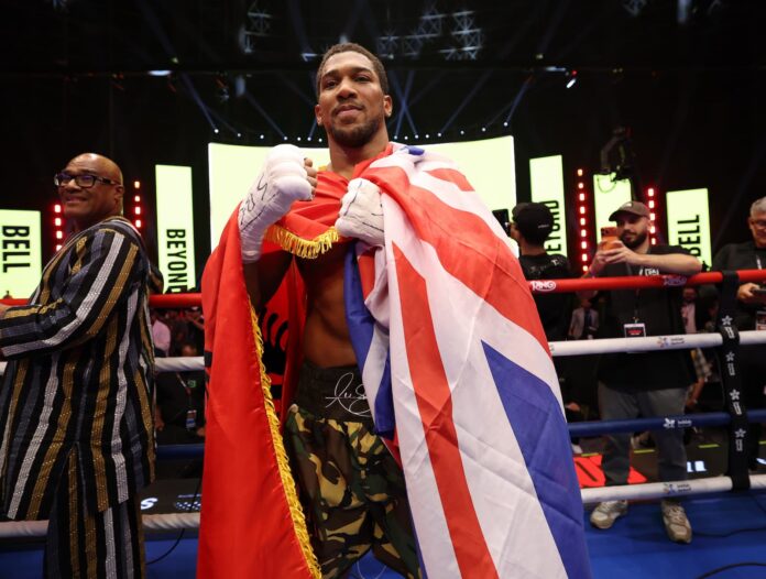 Anthony Joshua celebrates his victory over Kristian Prenga