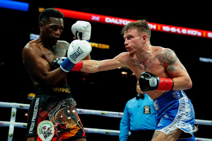 Dalton Smith throws a punch during his bout against Subriel Matias