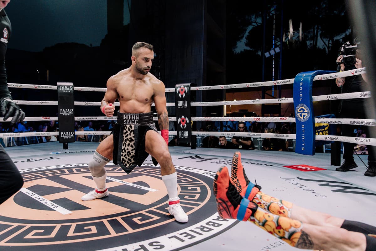 Dan Chapman knocks down Marco Giustarini during their bout