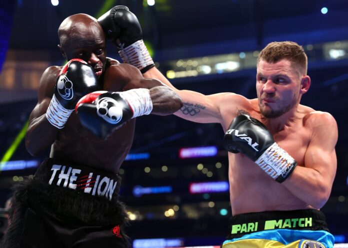 Denys Berinchyk throws a punch during his bout against Yvan Mendy
