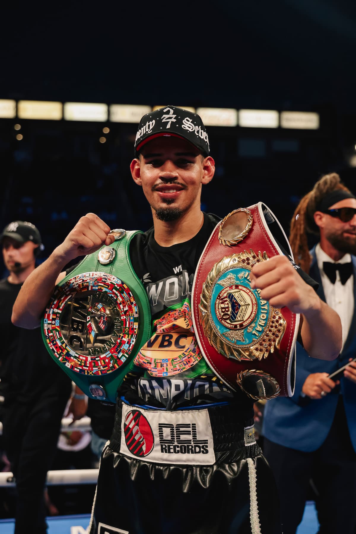 Diego Pacheco poses with his championship belts after his victory over Immanuel Aleem