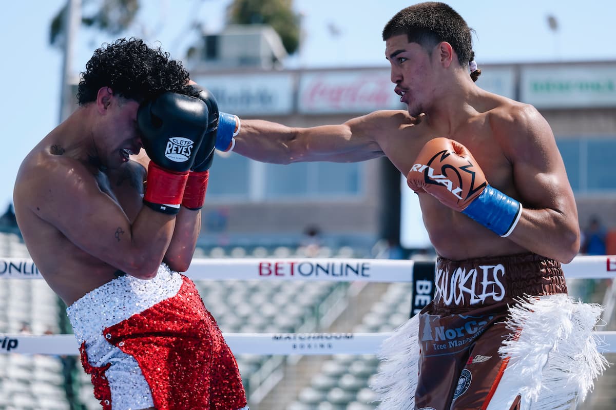 Frank Espinoza lands a punch during his bout against Luis Caraballo Ramos