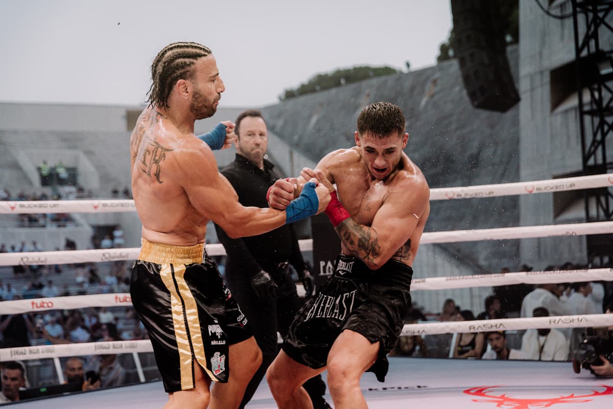 Gianni Melillo throws an uppercut during his bout against Dawid Chylinski