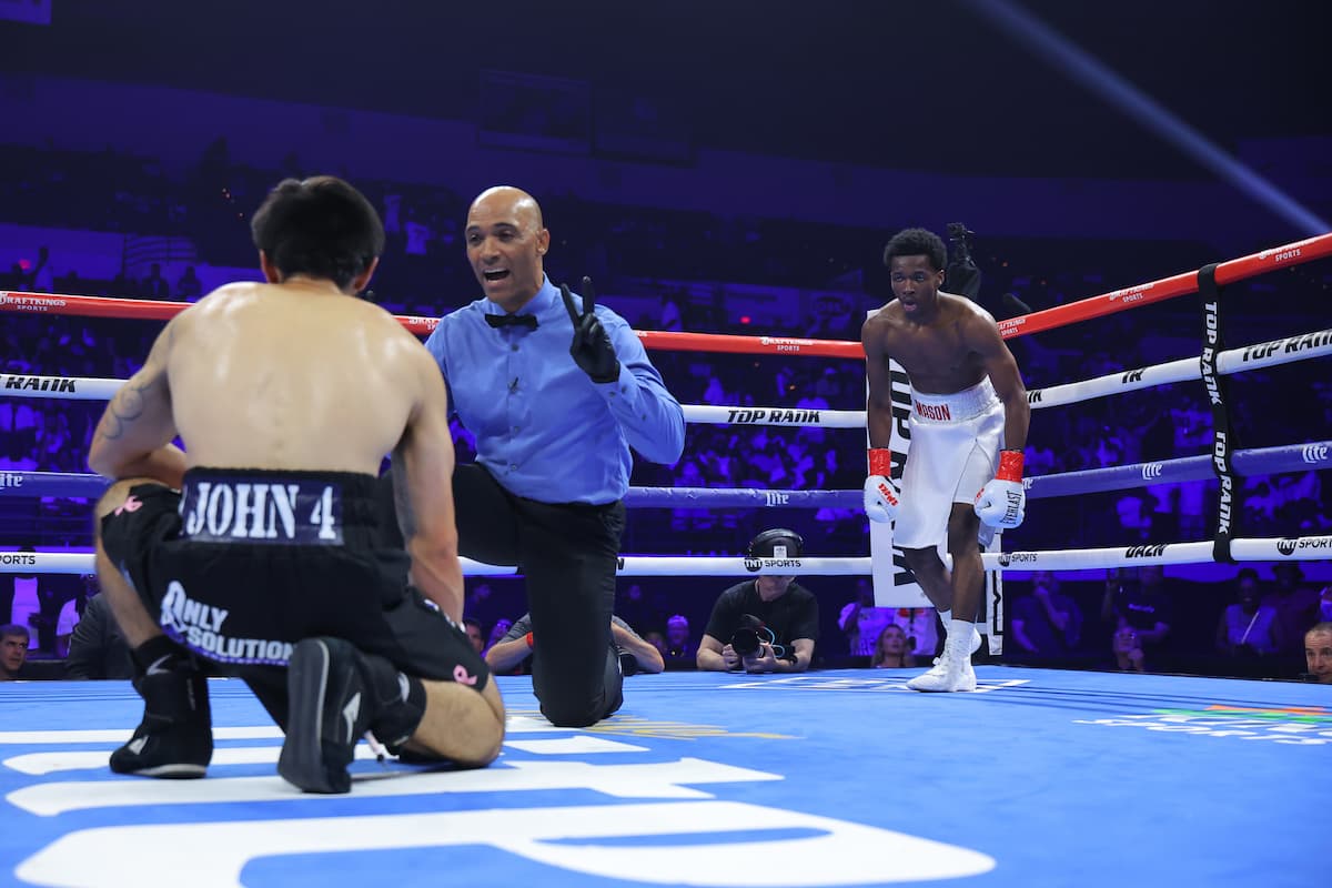 The referee gives Erik Hanley an eight count while Ibrahim Mason is in a neutral corner during their bout