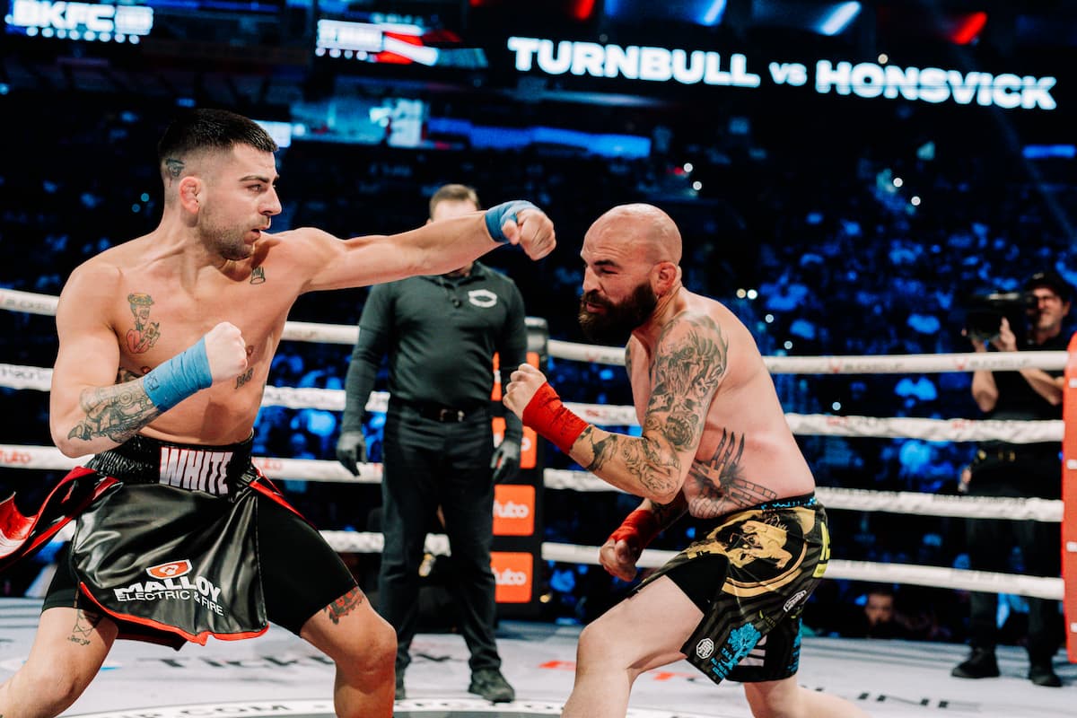 Matthew Turnbull throws a hook during the bout against Brandon Honsvick