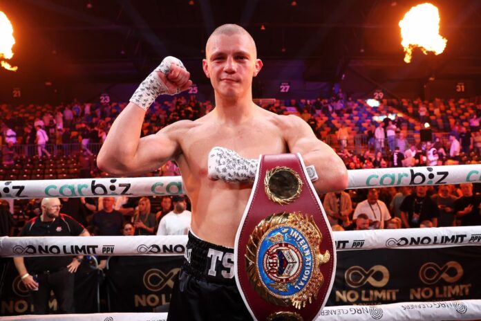 Nikita Tszyu poses with his belt following his victory over Oscar Diaz