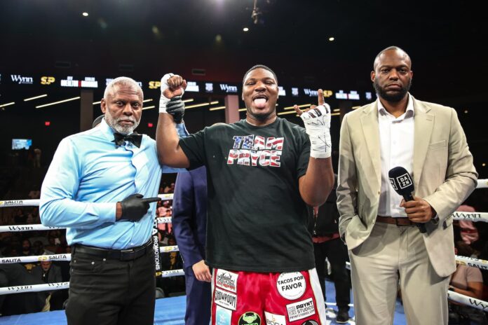 Pryce Taylor celebrates his victory in the ring after his bout against Calvin Barnett
