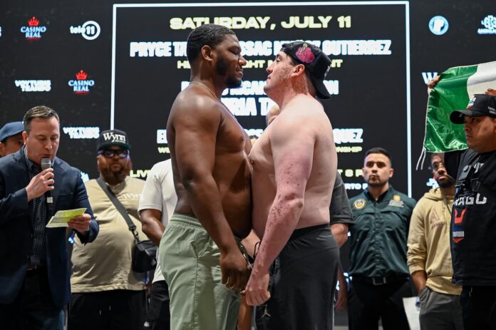 Pryce Taylor and Isaac Munoz Gutierrez face off during the weigh-in ahead of their boxing bout