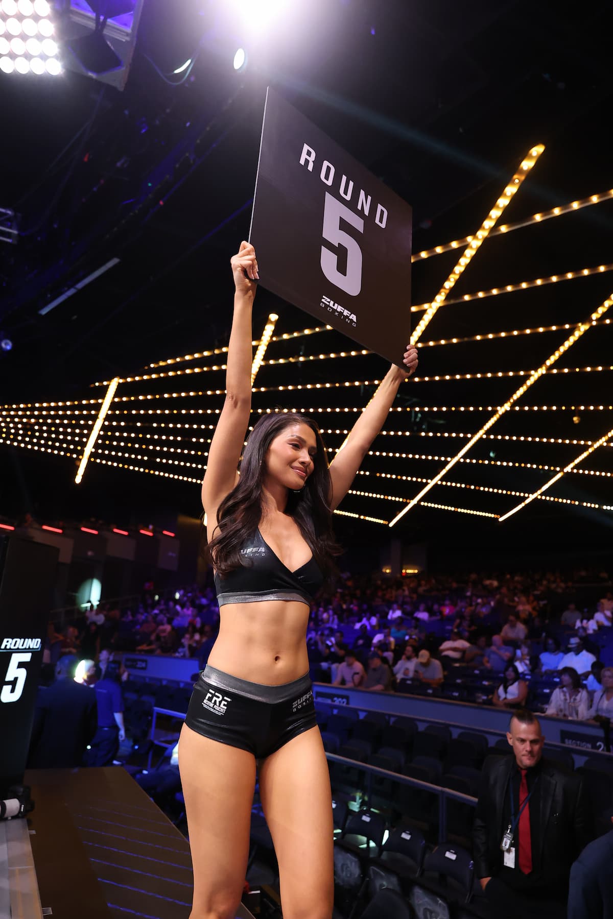 Ring girl Red Dela Cruz presents the Round 5 card during Zuffa Boxing 9