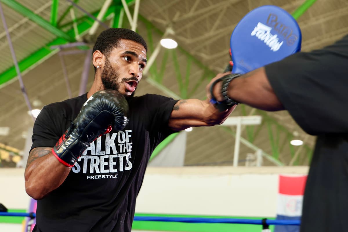 Tiger Johnson during mitt work at an open workout
