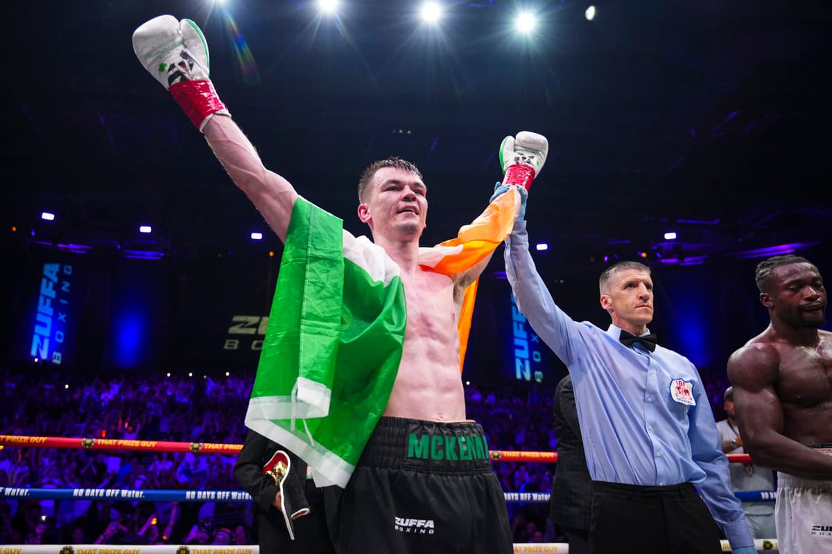 Aaron McKenna has his hand raised by the referee after his victory over Etinosa Oliha