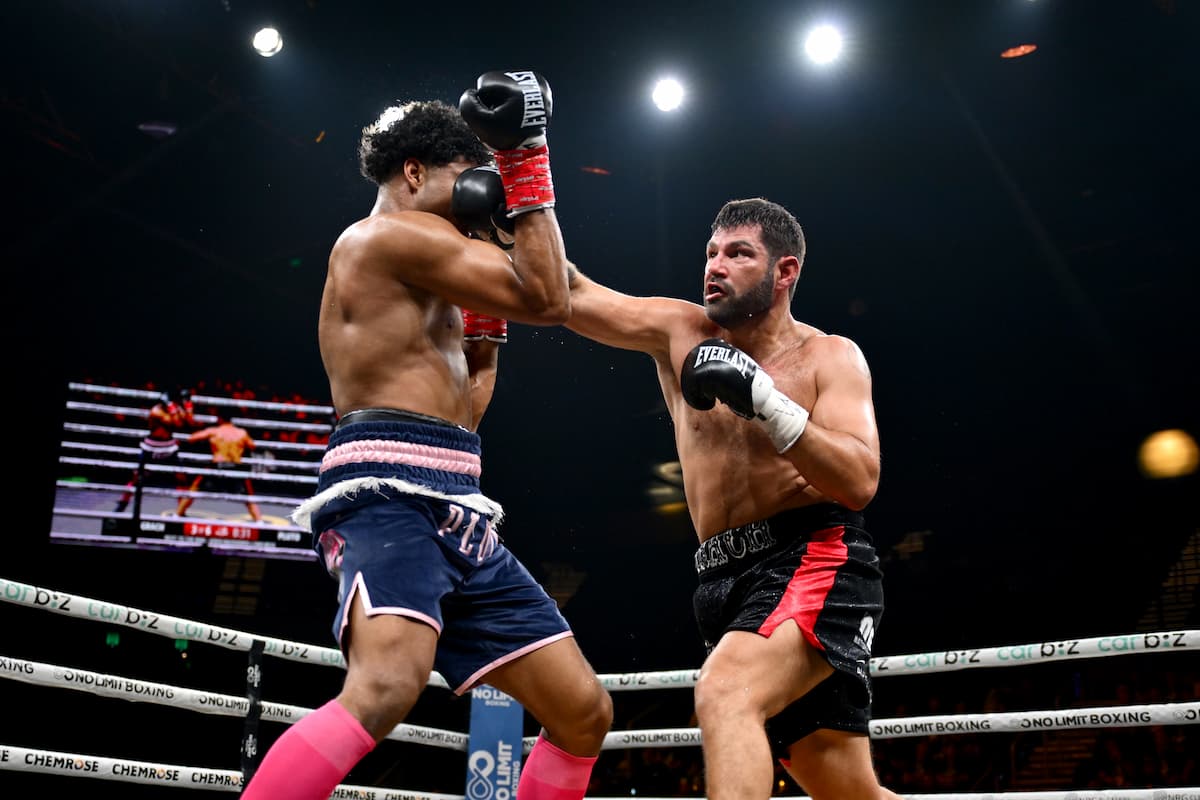 Brandon Grach lands a punch during his bout against Ike Pluto