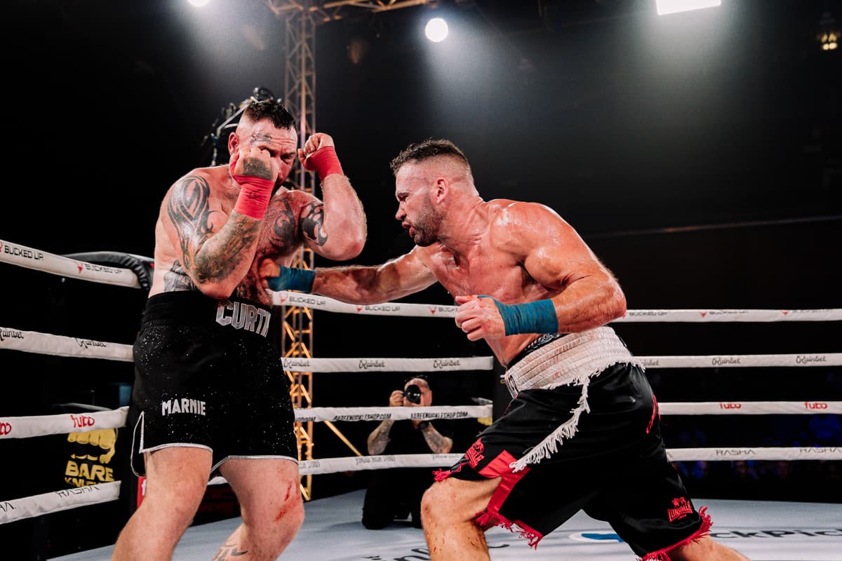 Chris Burton lands a punch during his bout against Daniel Curtin