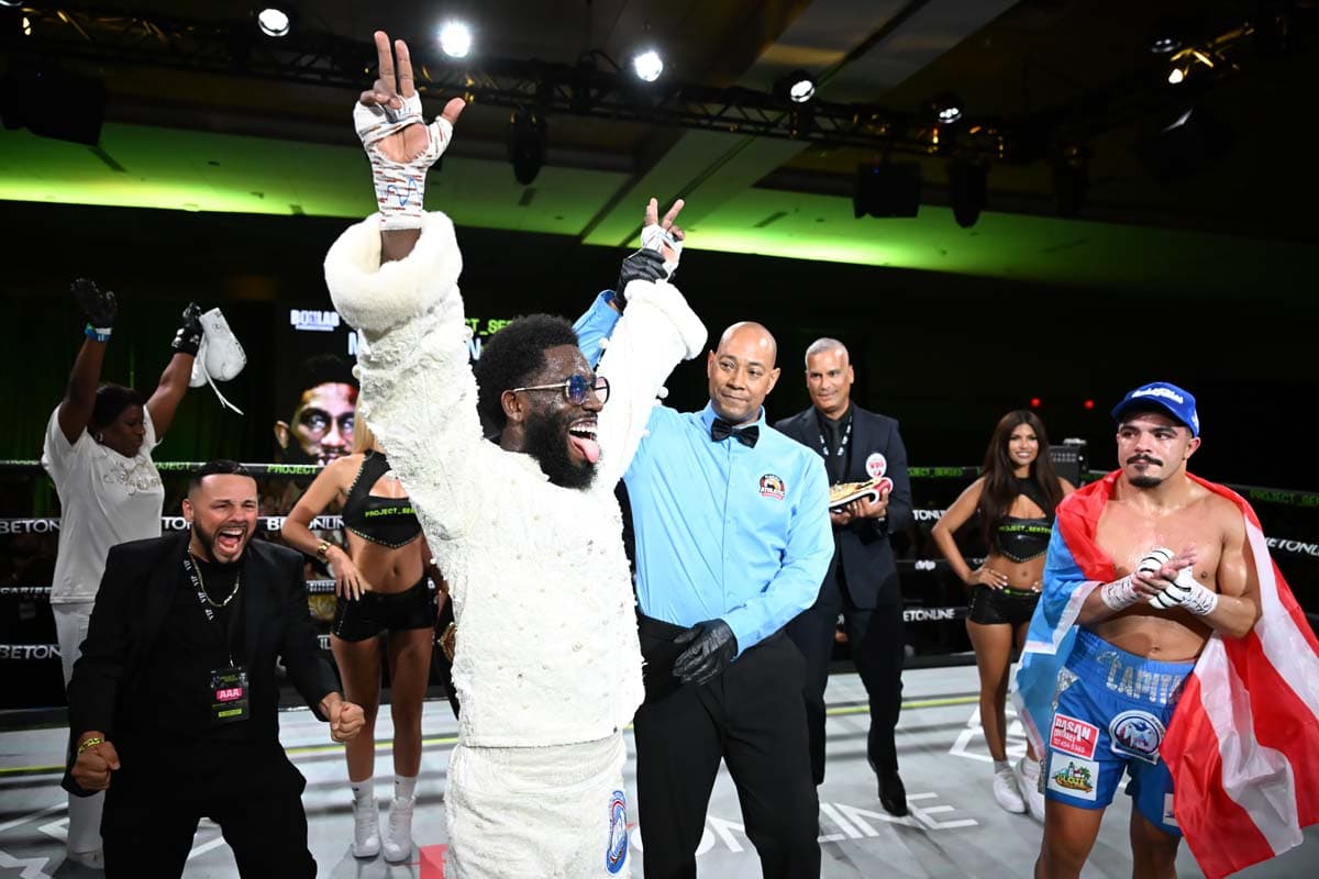 Corey Marksman has his hand raised in victory over Christian Barreto