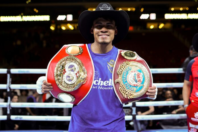 Emanuel Navarrete with his IBF and WBO championship belts after his victory over Eduardo Nunez