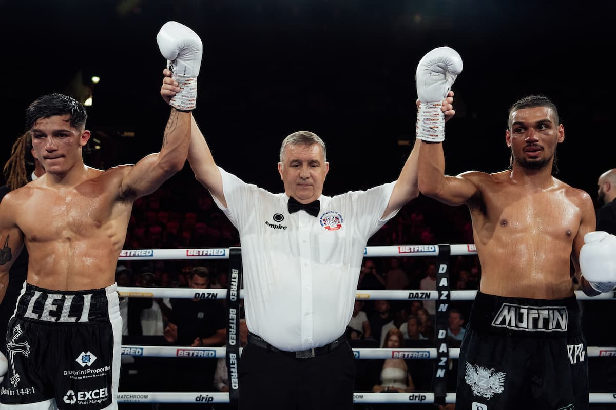 Emmanuel Buttigieg and P A Gordon have their hands raised by the referee after fighting to a draw