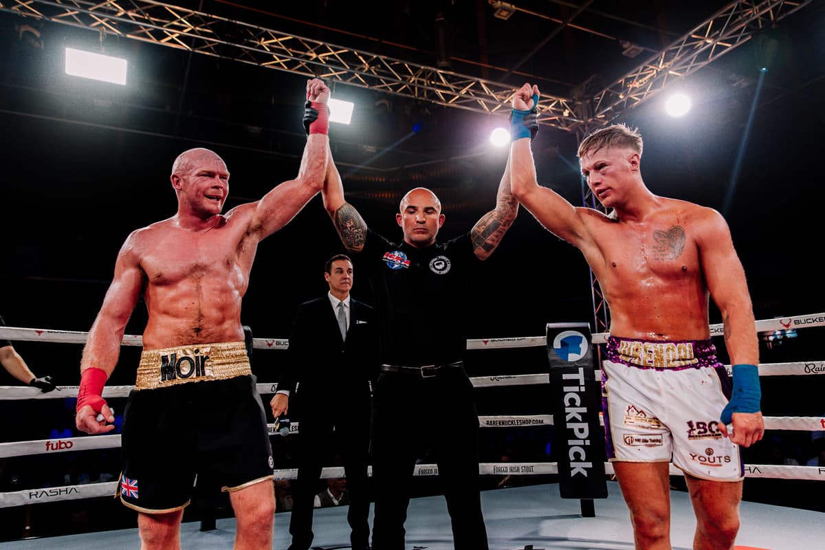 The referee raises both Harrison Cave and Danny Moir's hands after their draw