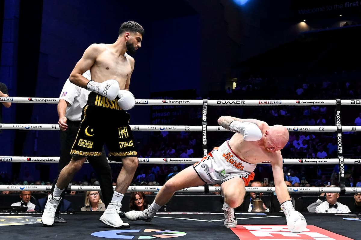 Hassan Azim knocks down Jack Martin during their bout