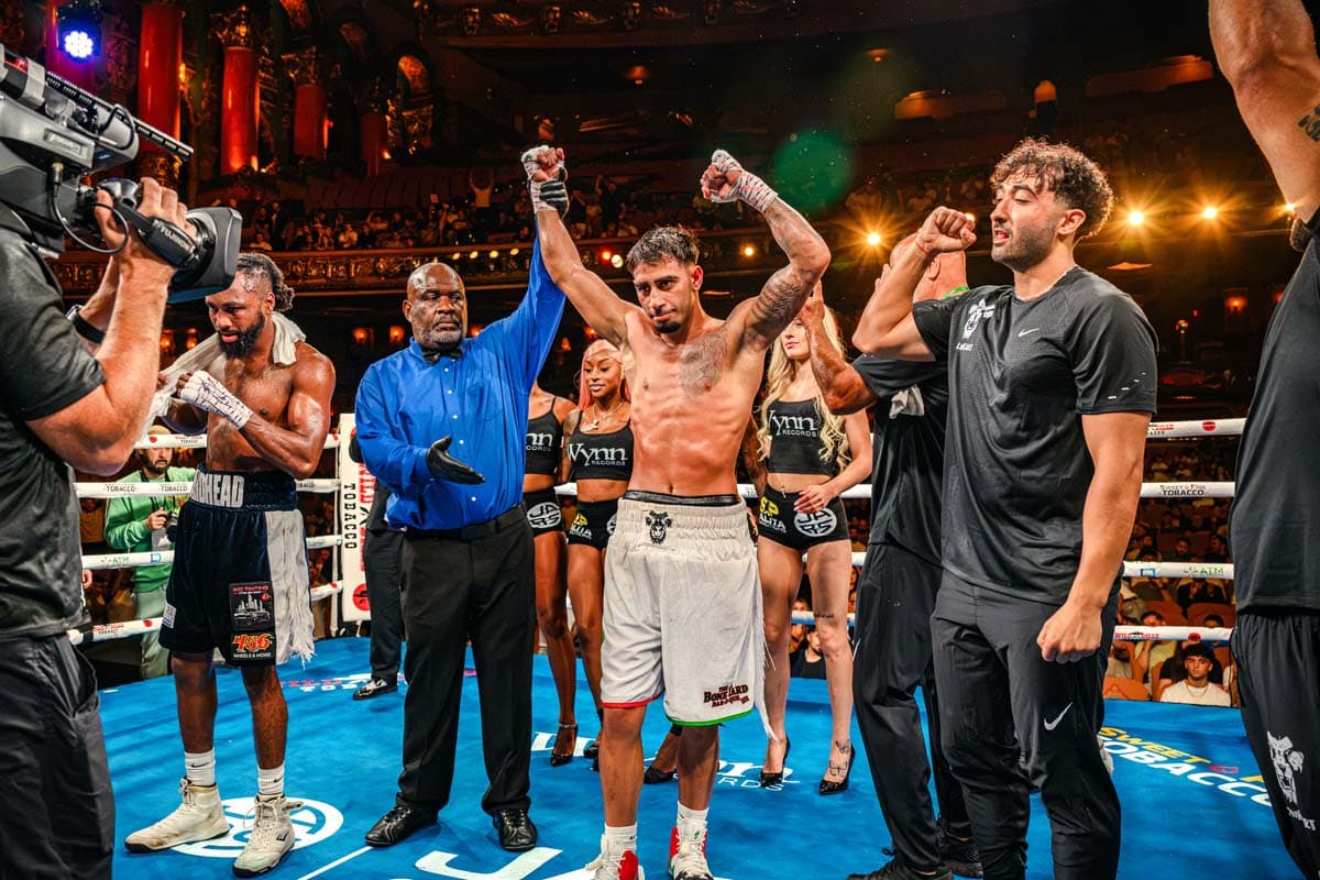 Husam Al Mashhadi has his hand raised by the referee in victory over Seantorius Martin