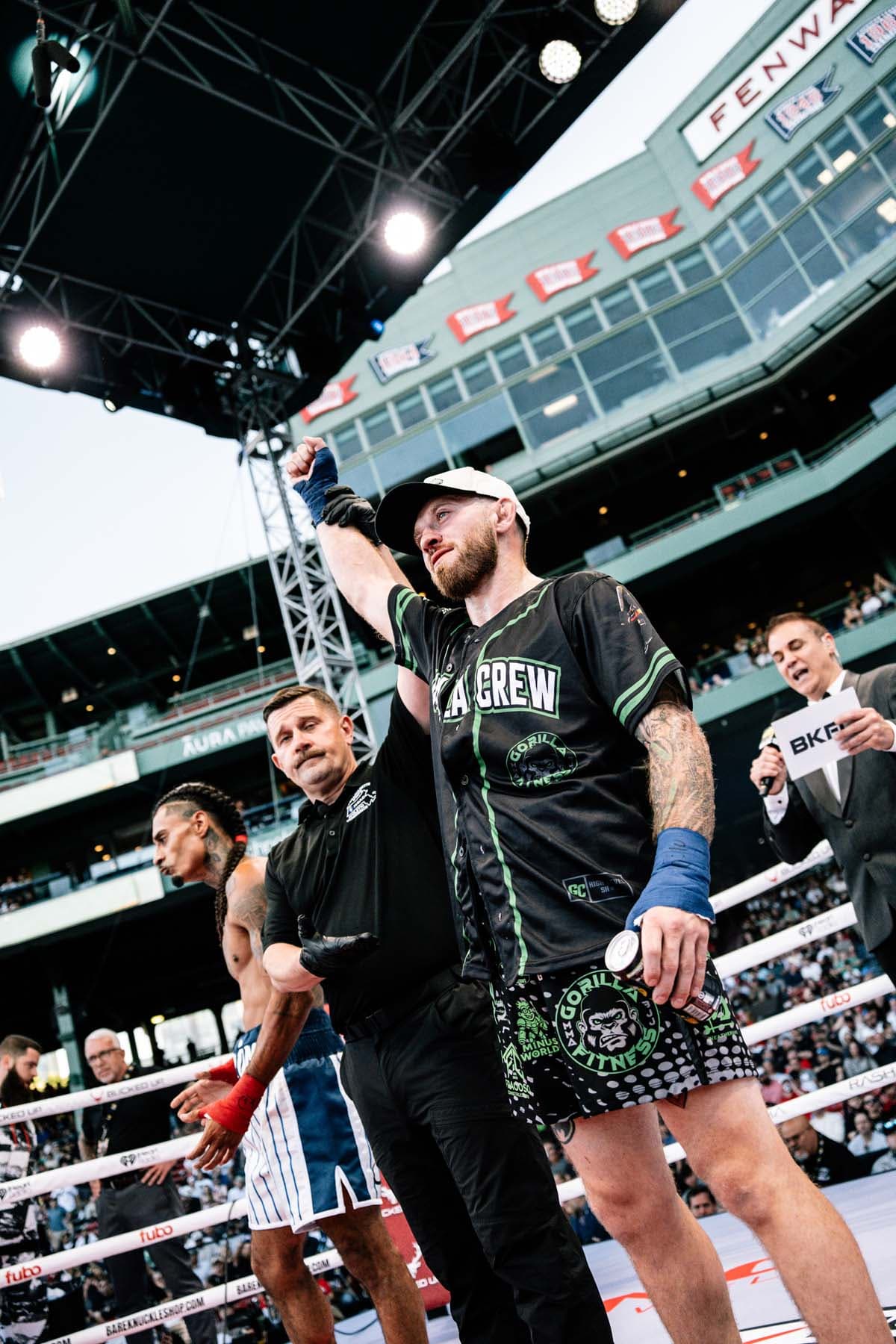 Jake Pilla has his hand raised in victory over Angelo Colon