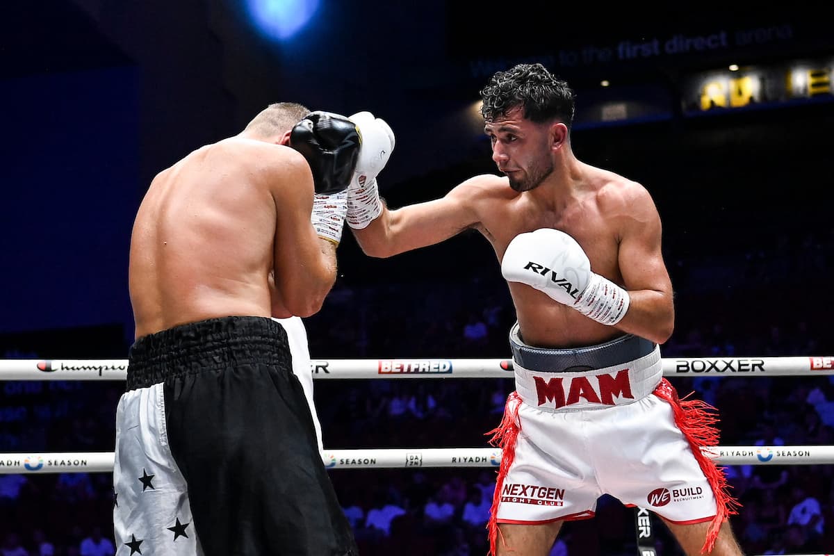James Dean Fury lands a punch during his bout against Dzmitry Atrokhau