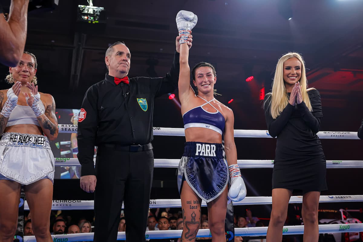 Jasmine Parr has her hand raised by the referee after her victory over Jemma Peart