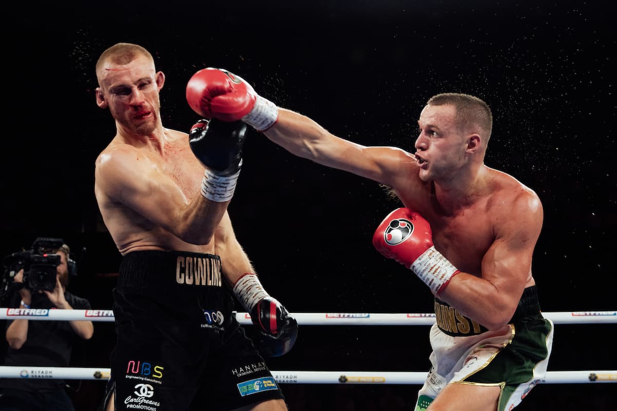 Jimmy Sains throws a punch during his bout against Tom Cowling