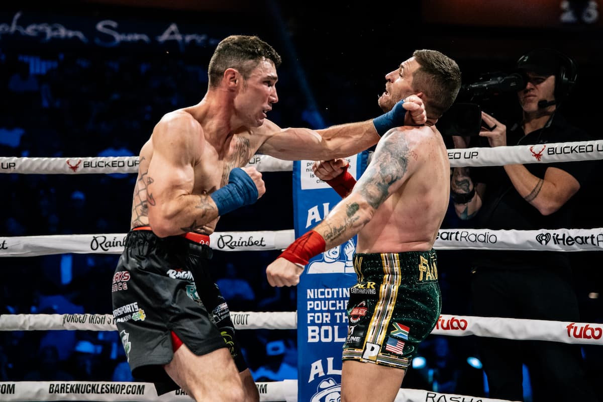 Joey Gambino lands a punch during his bout against Tommy Strydom